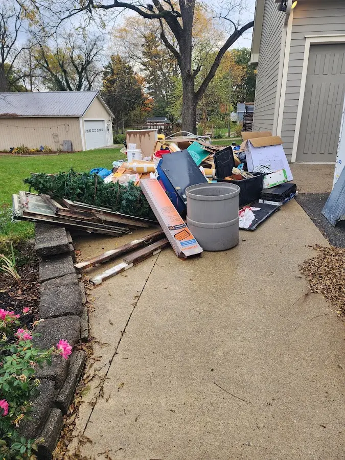 Dumpster being loaded with debris for 3 Yard Dumpster Rental in Provo